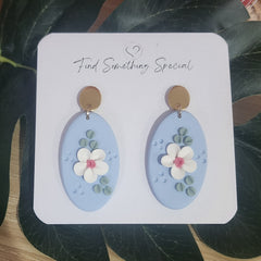 Polymer Clay Earrings - white Floral design on Blue Oval